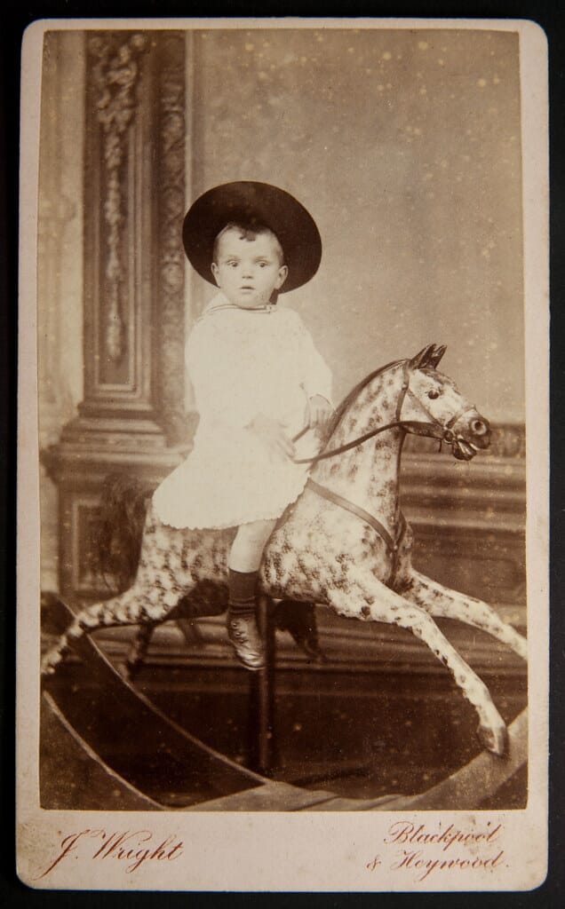 Unknown lad on a rocking horse, by J Wright, Blackpool & Heywood