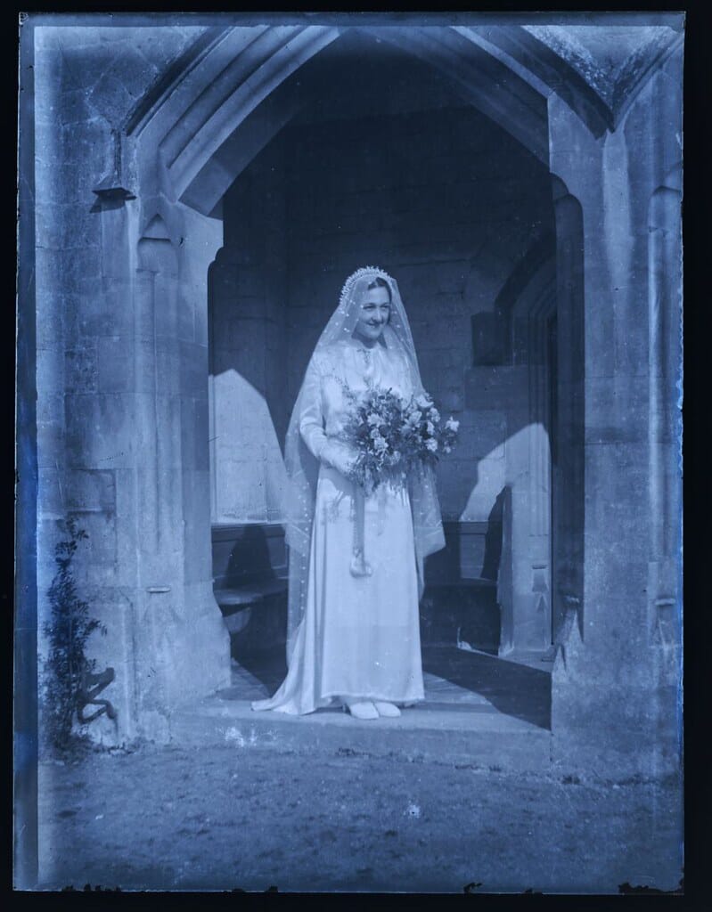 Young bride at the door of Poor Clares Priory, Stroud, Gloucestershire